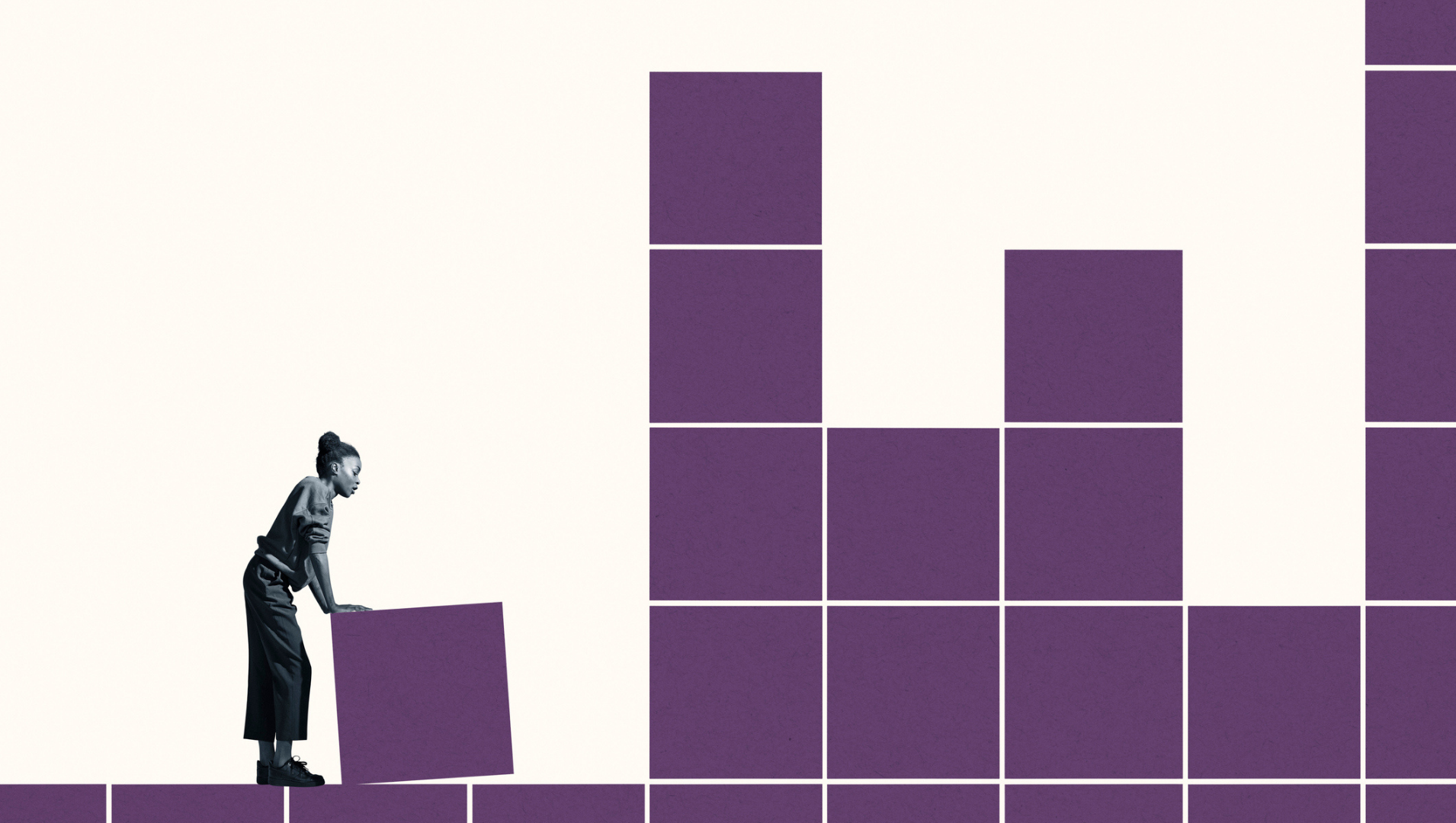 a woman moving a block closer to a high stack of blocks, as if to set a goal to climb over them
