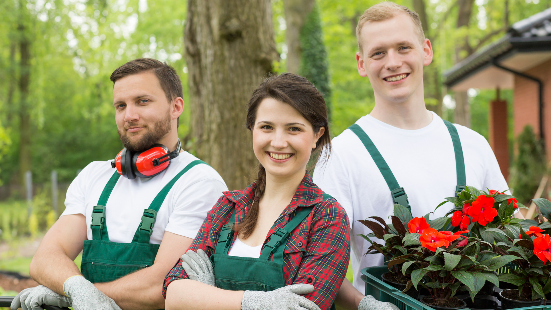 three gardeners smiling