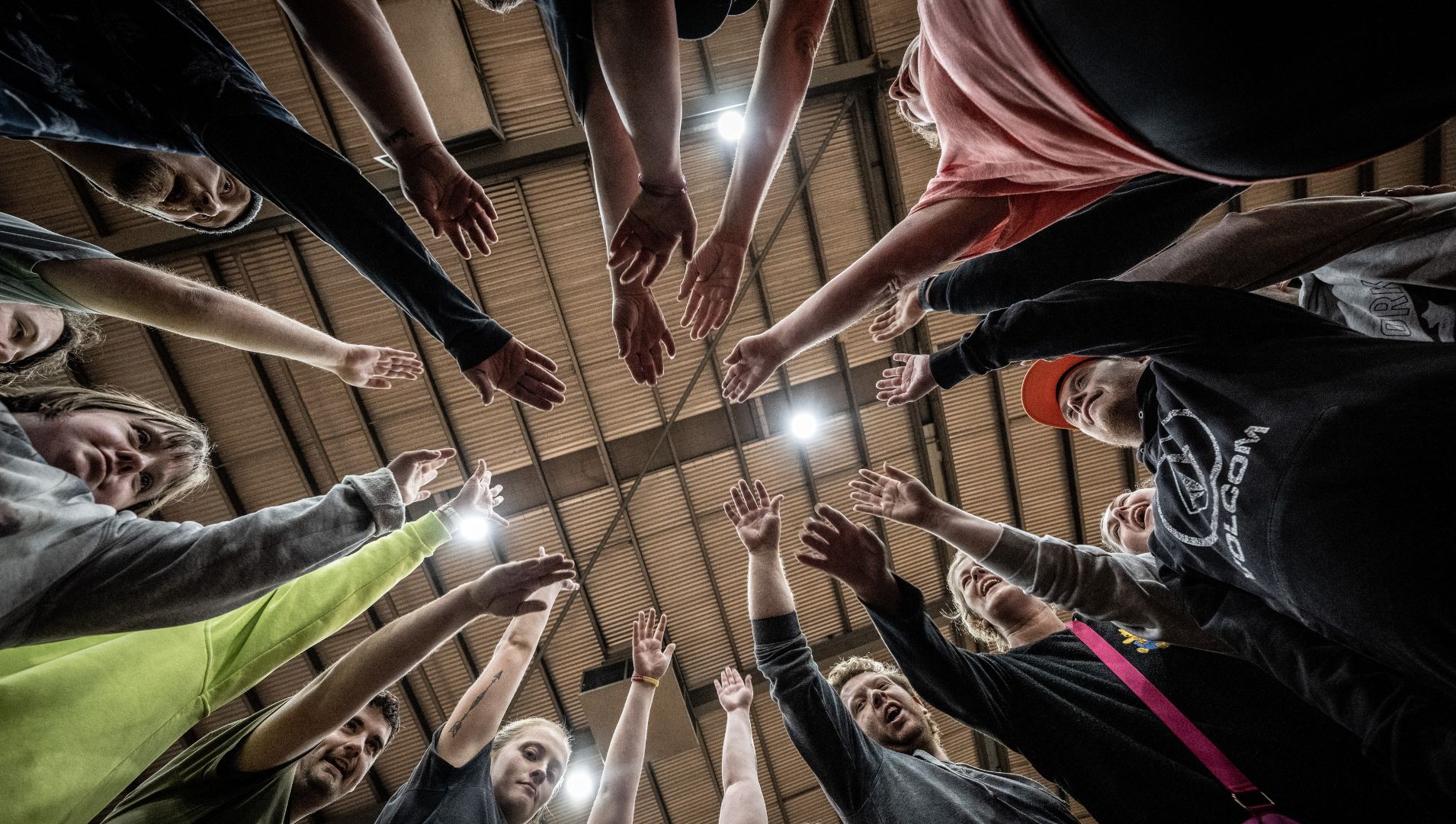 Players form a circle of hands in the all ability basketball team